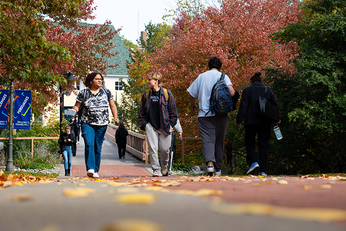 students walking on campus in the fall